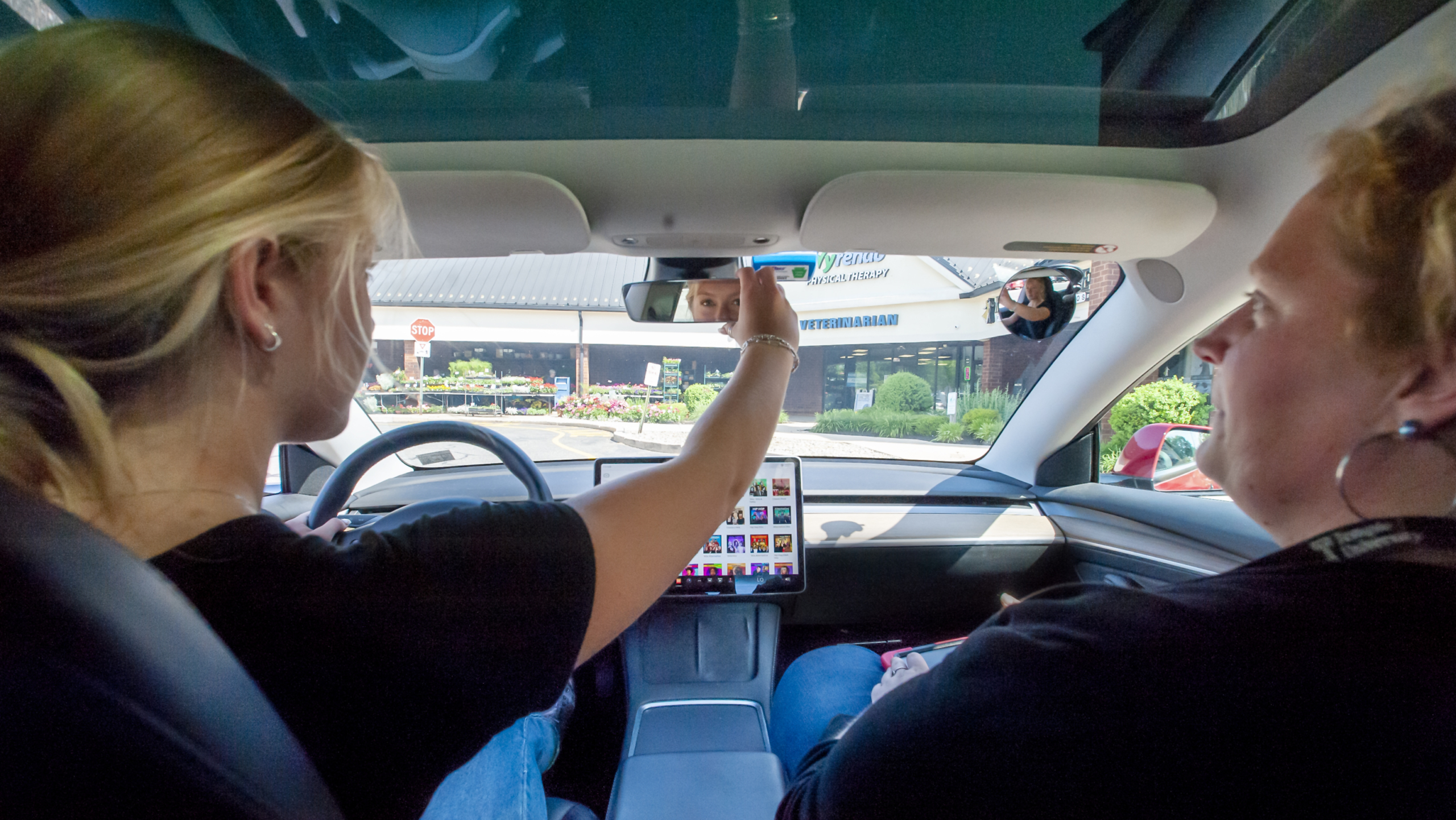 student driver checking mirror